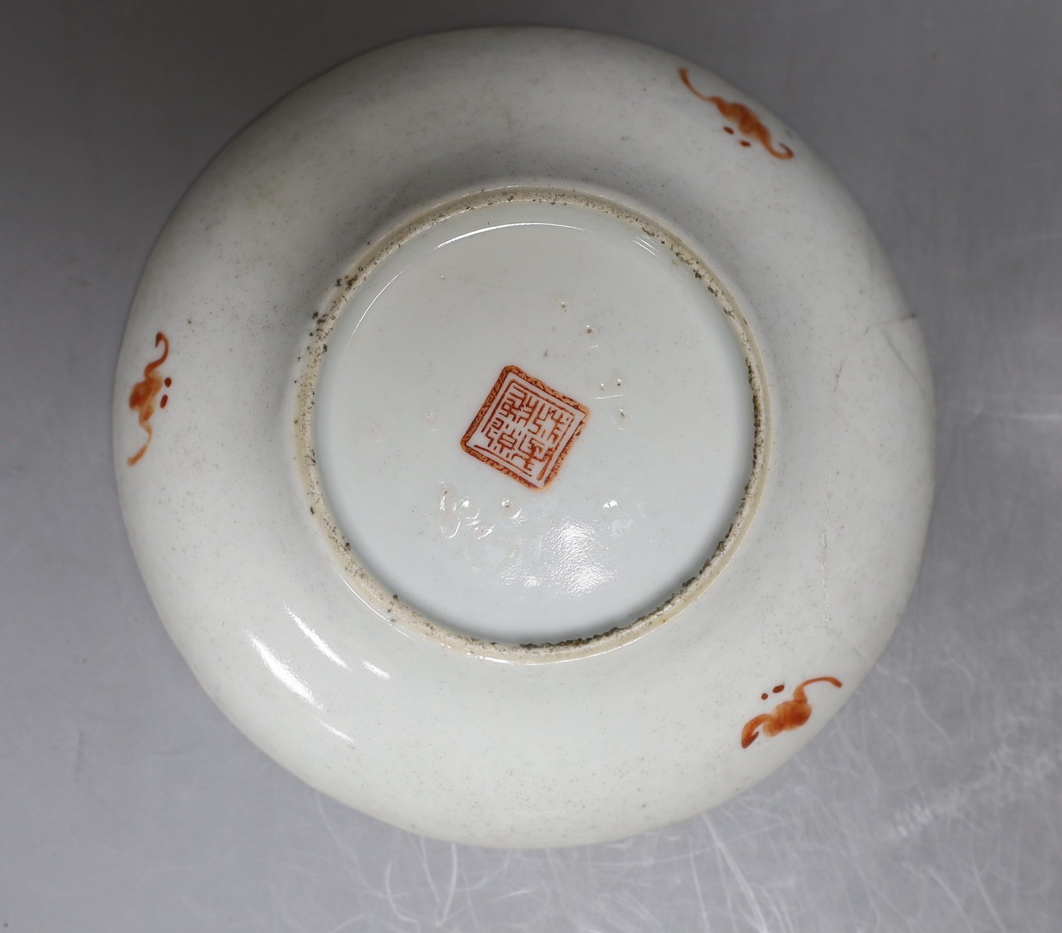 A Chinese blue and white dragon bowl, another blue and white bowl and a saucer, 19th century, largest 20.5cm